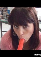 Hailey blows a popsicle