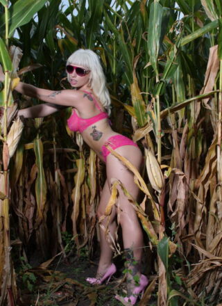 Lynn Pops Sunbathing In The Cornfield With Her Pink Sunglasses On