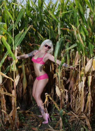 Lynn Pops Sunbathing In The Cornfield With Her Pink Sunglasses On