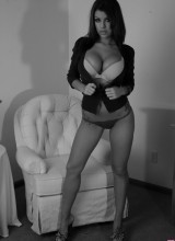 Briana Lee Poses In A Chair In A Sexy Black And White Set