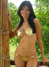 Karla Spice Lets The Sun Caress Her Soft Skin As She Removes Her Golden Laced Up Bikini