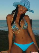 Karla Spices Hangs Out By The Shore Wearing Bikini Bottoms And A Blue Hat