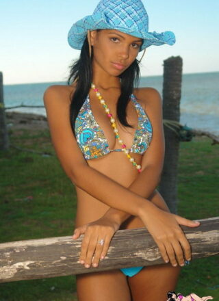 Karla Spices Hangs Out By The Shore Wearing Bikini Bottoms And A Blue Hat
