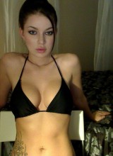 Miss Korina Bliss Shows Off Her Big Tits In A Tiny Black Bikini On Webcam