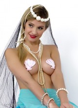 Pin-Up Wow: Pretty blonde mermaid Elle Richie takes you to a sexy fantasy land.