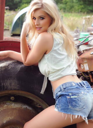 Jess Davies Teasing In Her Tied Top And Blue Denim Shorts By The Old Tractor