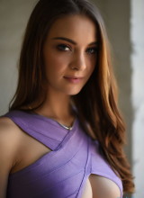 Emelia Paige Teasing In Lavender Dress In Front Of The Window
