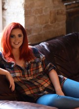 Lucy V Teasing On The Sofa In Plaid Shirt And Jeans