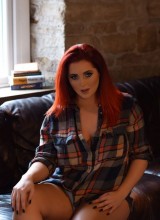 Lucy V Teasing On The Sofa In Plaid Shirt And Jeans